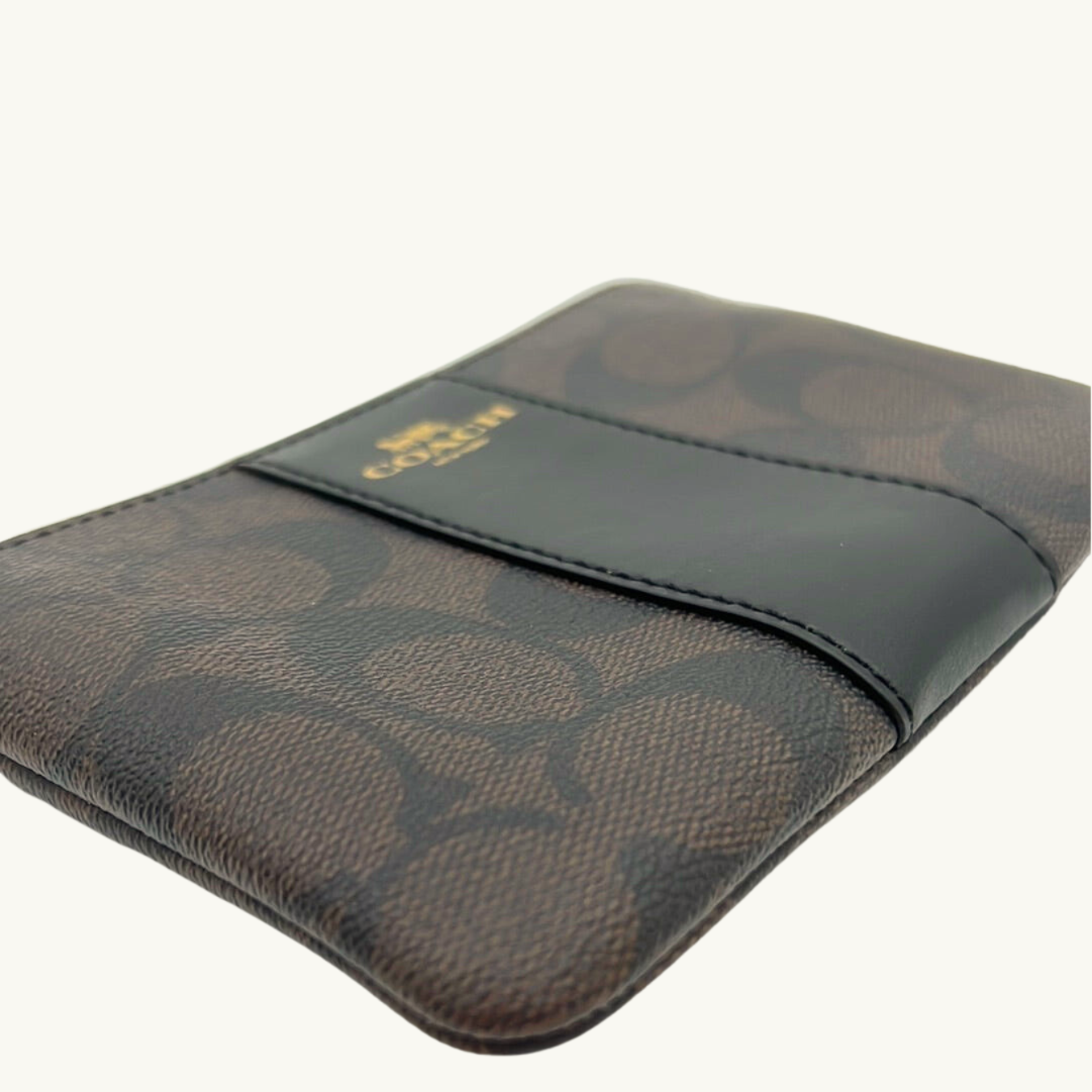コーチ ポーチ / CORNER ZIP WISTLET IN SIGNATURE CANVAS / ブラウン ブラック シグネチャーキャンバス